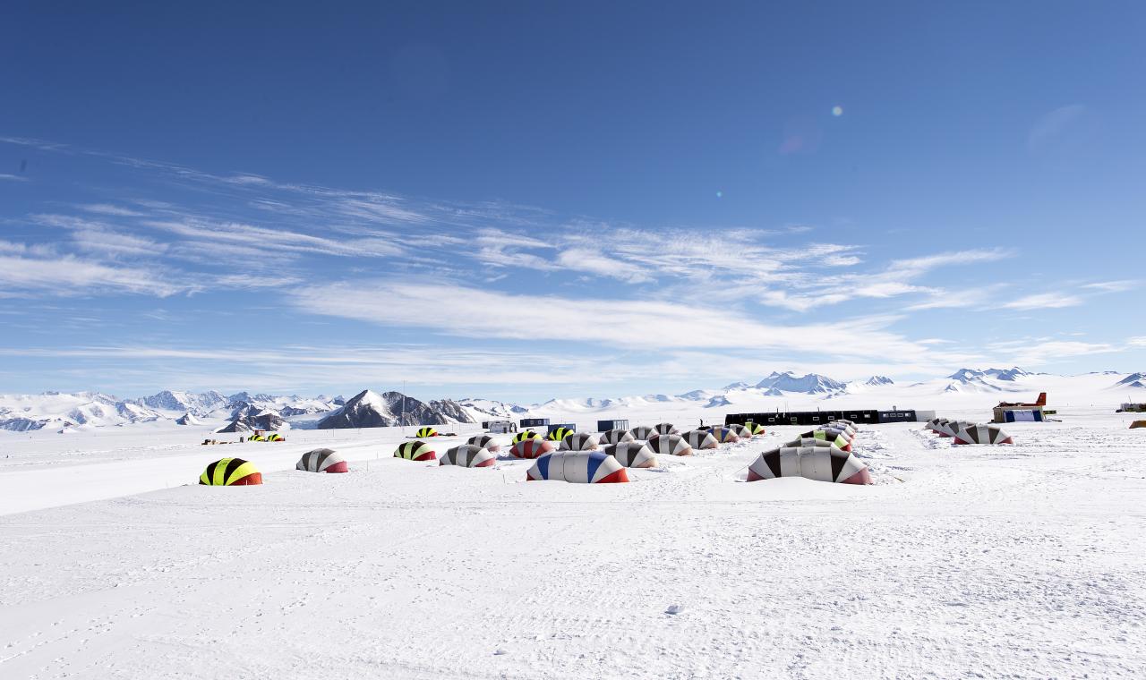 Tented camp with mountains and open sky in Antarctica