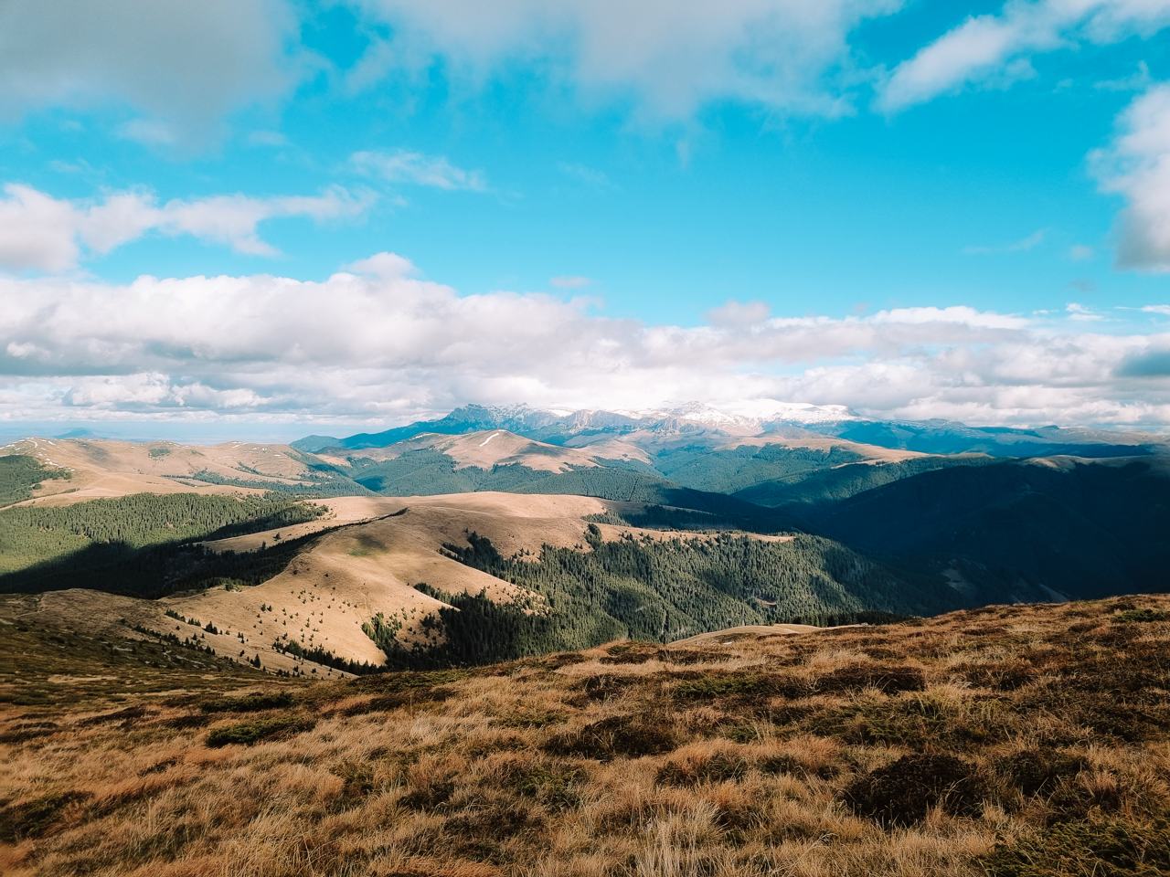 View over the rolling ridges of the Carpathians with snow covered peaks