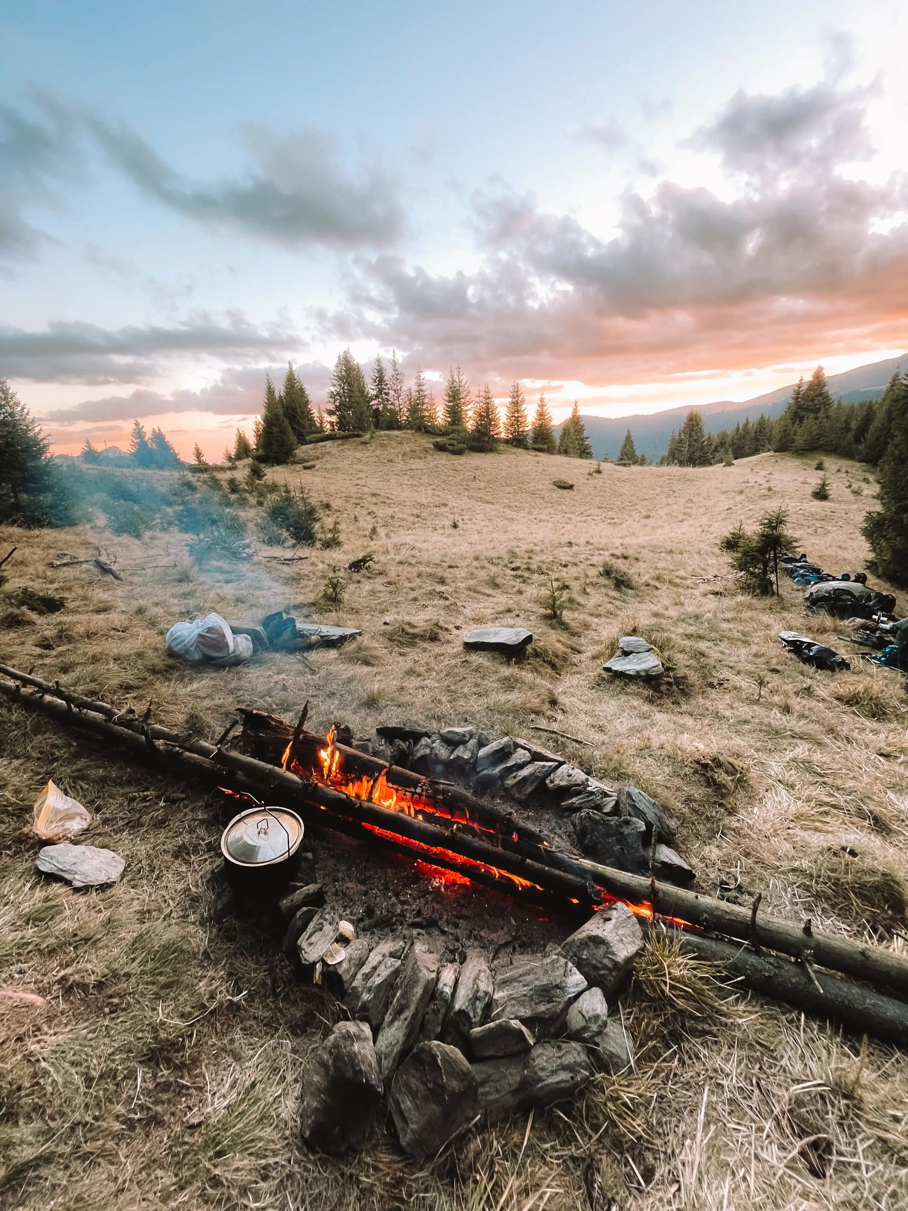 Campfire at sunset during a bivouac in the Carpathians